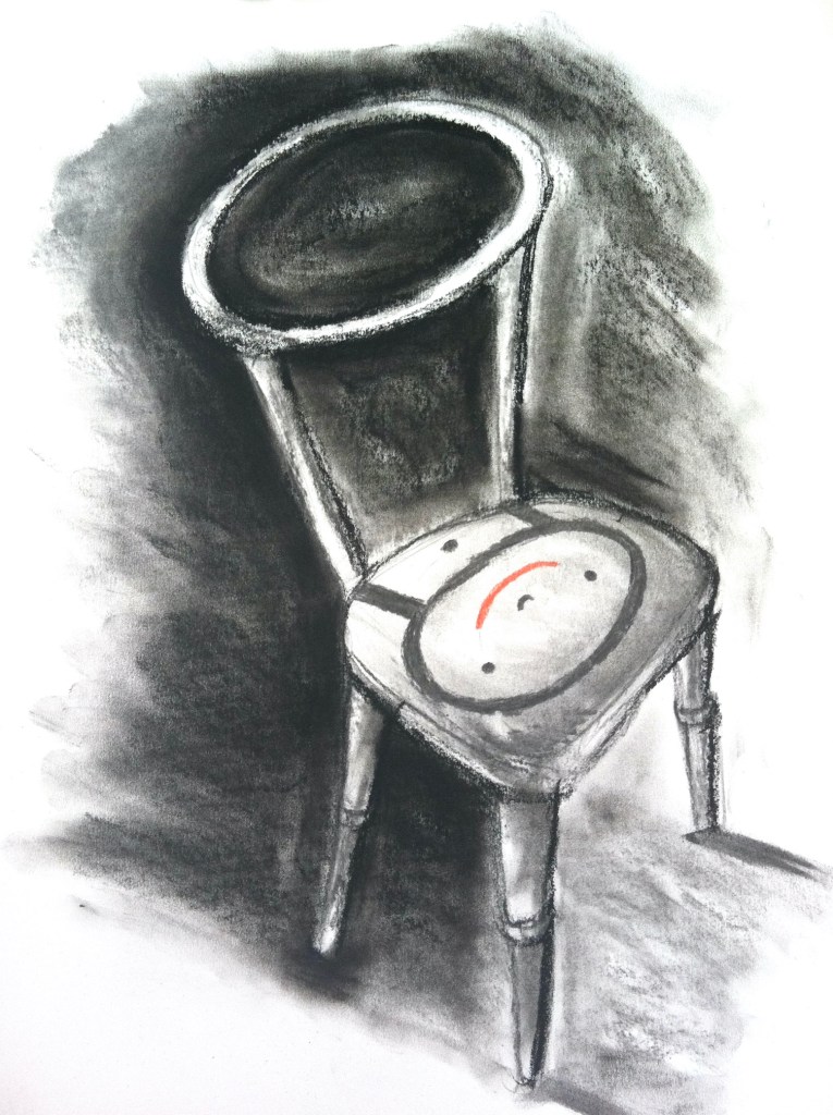 Empty chair with smiling cushion as symbol of welcome to child refugees