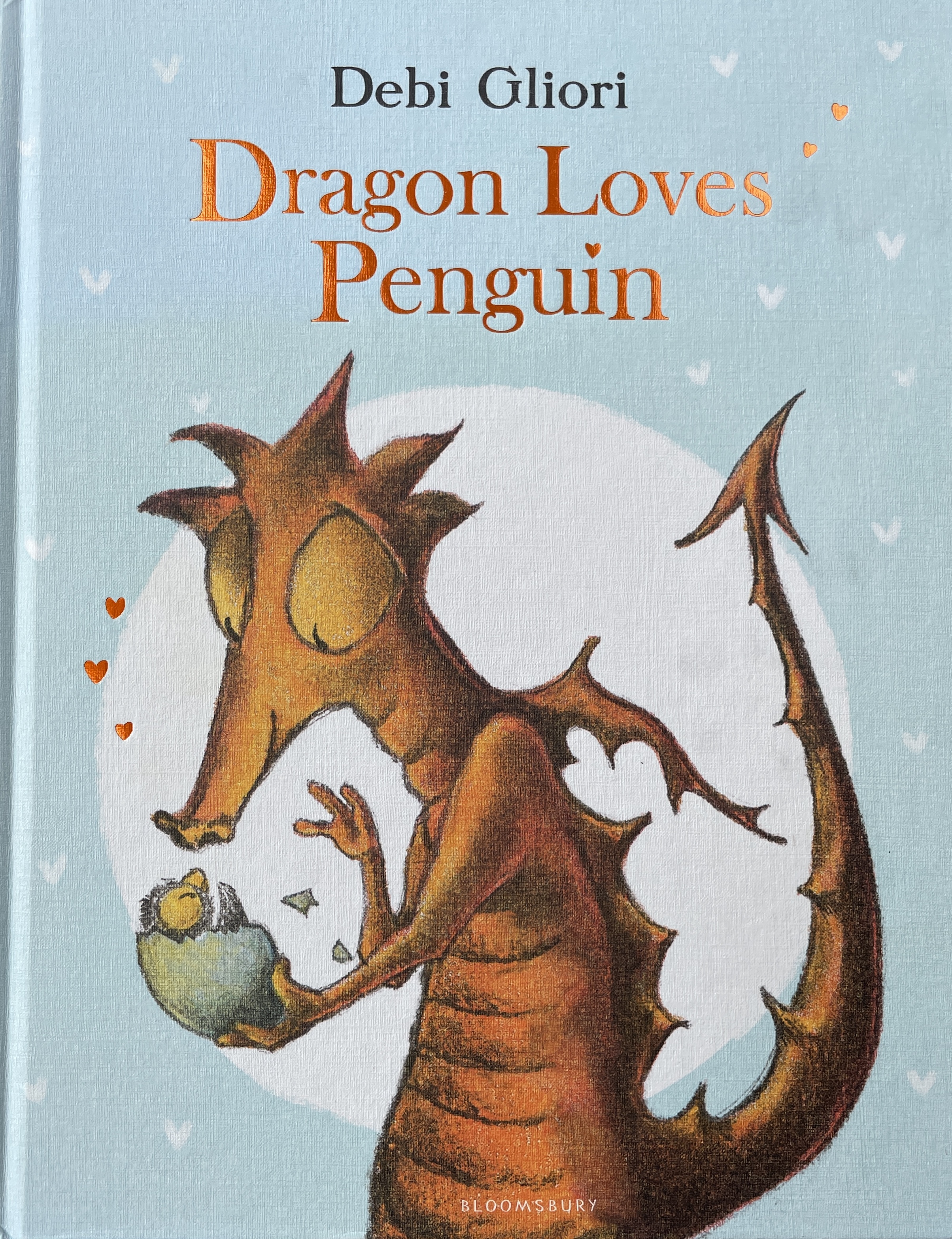 Dragon mother holding newly hatched penguin and greeting it as her newborn child