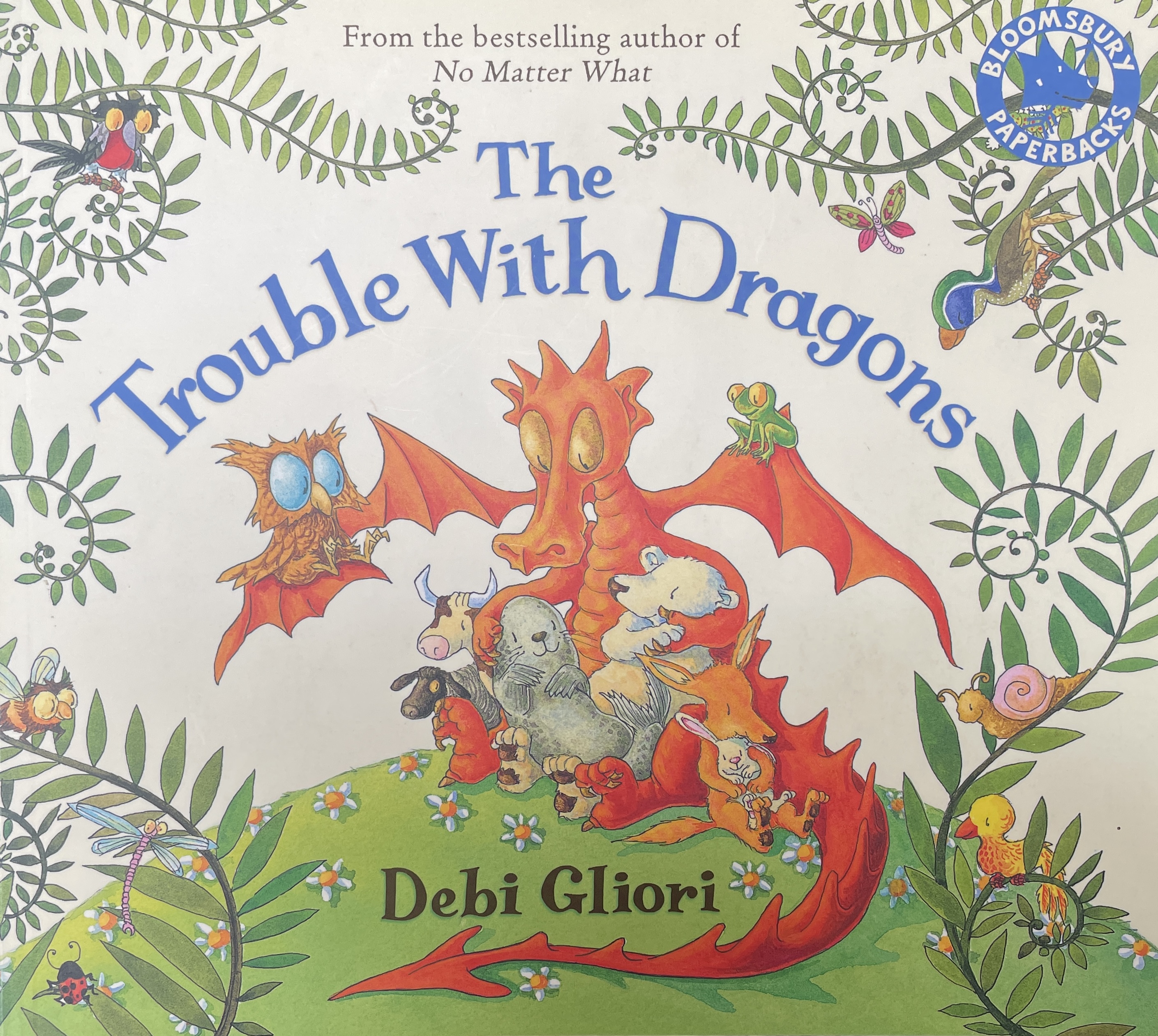 Book cover with dragon surrounded by animals and plants on subject of climate change
